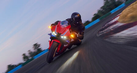 Honda CBR600RR coming out of corner on race track